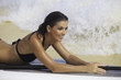 woman with her paddle board at a hawaii beach