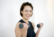Woman lifting dumbbells