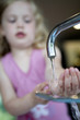Little girl washing hand
