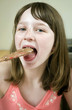 Girl tasting baking ingredient