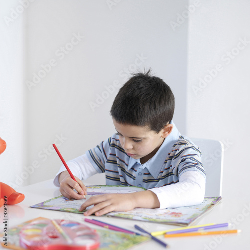 Photo: Boy doing homework Boy doing homework