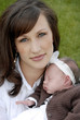Mother carrying baby girl