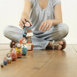 Woman arranging Matryoshka dolls on the floor