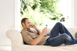 Man talking on the mobile phone while holding credit card