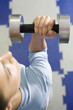 Woman lifting dumbbell