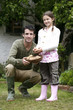 Man and girl with a basket of potatoes