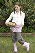 Girl holding a basket of potatoes
