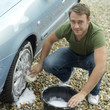 Photo: Man washing car wheel Man washing car wheel