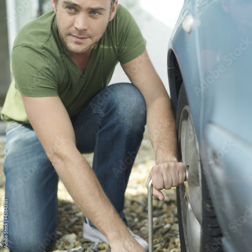 Photo: Man changing tyre Man changing tyre