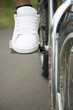 Boy's foot on bicycle pedal