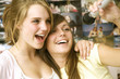 Girls singing into microphone