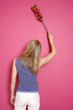 Woman dusting the wall