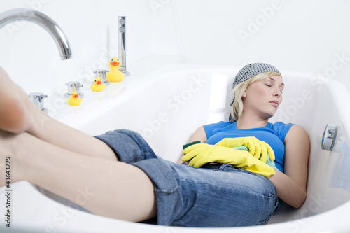 Photo: Woman sleeping in the bathtub Woman sleeping in the bathtub
