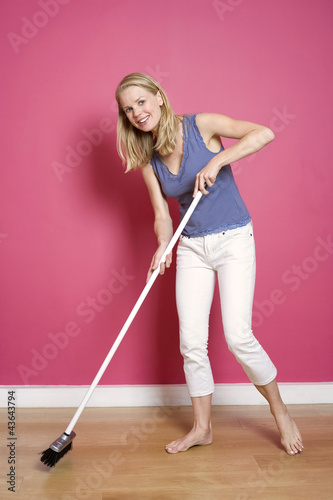 Photo: Woman sweeping the floor Woman sweeping the floor
