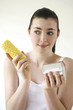 Woman holding corn and canned food