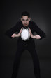 Businessman playing rugby