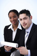 Photo: Businessman and businesswoman smiling Businessman and businesswoman smiling