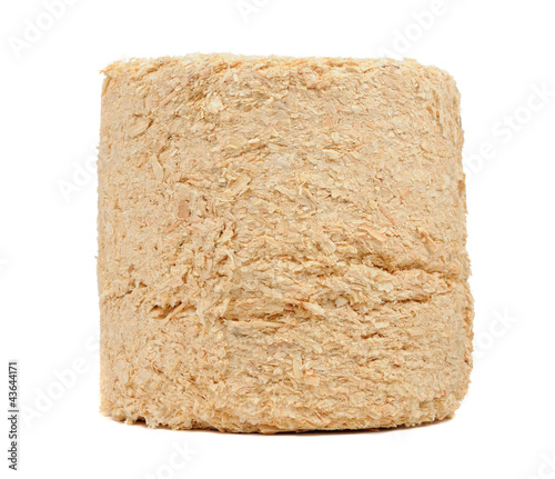 Photo: Compressed Sawdust Fire Log Isolated on White Background Compressed Sawdust Fire Log Isolated on White Background