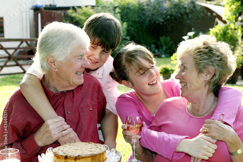 Photo: A girl and boy giving their grandparents a surprise visit A girl and boy giving their grandparents a surprise visit