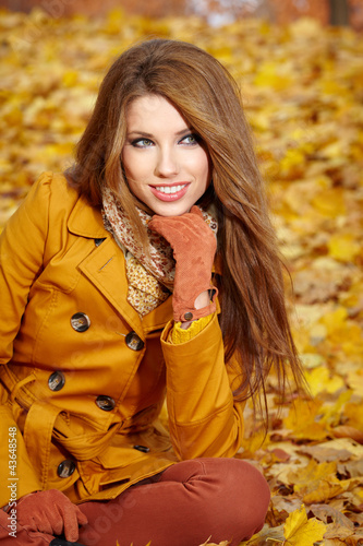 Photo: young brunette woman portrait in autumn color young brunette woman portrait in autumn color