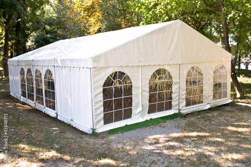 Photo: White big tent in forest White big tent in forest