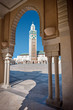 Photo: View of the Hassan II Mosque by a decorative arch View of the Hassan II Mosque by a decorative arch