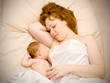 Mother is breast feeding a newborn baby