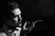 young man smoking a cigarette