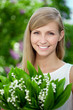 Portrait of young beautiful smiling woman outdoors