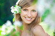 Foto: Smiling beautiful woman with flowers Smiling beautiful woman with flowers