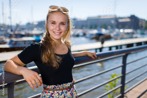 Photo: Girl and city harbour Girl and city harbour