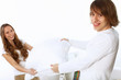 Foto: Young couple fighting with pillows Young couple fighting with pillows