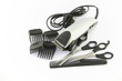 hair clipper, comb and scissors on white background