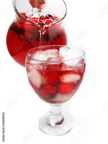 Photo: pouring punch cocktail drink with fruit pouring punch cocktail drink with fruit