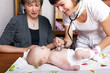 Doctor examines baby