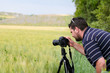 Photo: Photographer with tripod and DSLR camera Photographer with tripod and DSLR camera