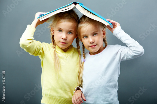 Photo: Twins under book Twins under book