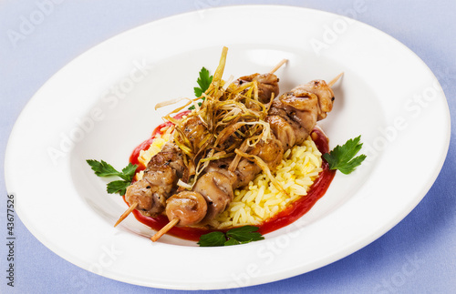 Photo: Grilled meat with rice parsley onions in red sauce Grilled meat with rice parsley onions in red sauce