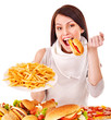 Woman eating fast food.