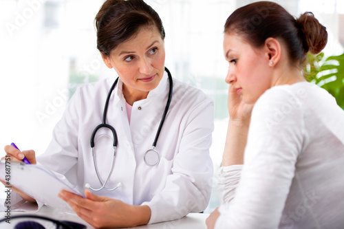 Photo: doctor with female patient doctor with female patient