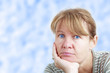 Thinking woman looking into the camera