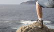 Leg with a boot on a seascape