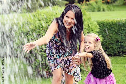 Photo: Happy mother and daughter in park Happy mother and daughter in park