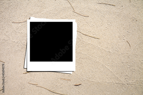 Photo: Photo paper on sand background Photo paper on sand background