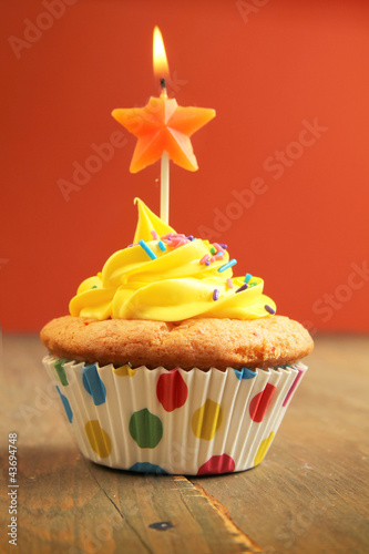 Photo: Cupcake with star candle Cupcake with star candle