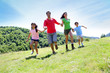 Photo: Happy family enjoying and running together in the mountains Happy family enjoying and running together in the mountains