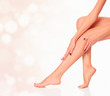 Perfect female legs on blurred background. Luxury style.