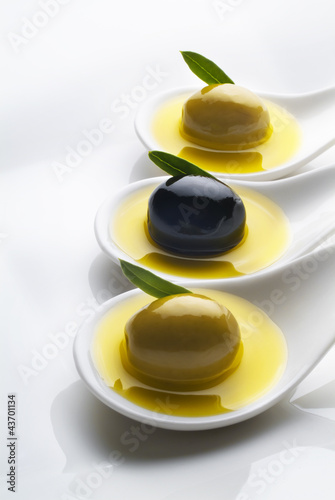 Photo: olive green and black olives olive green and black olives