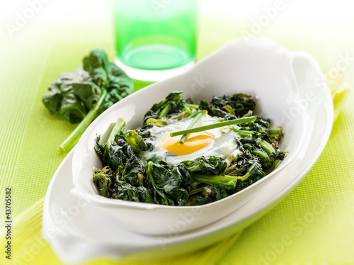 Photo: egg over boiled spinach,selective focus egg over boiled spinach,selective focus