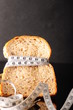 canvas print picture - bread surrounded by tapeline